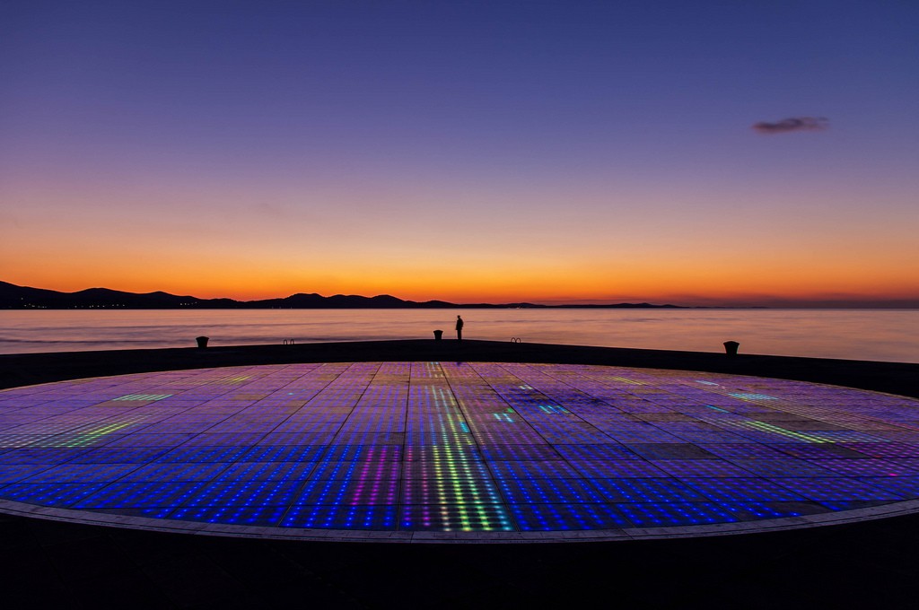 Zadar's amazing "Greetings to the Sun" installation at sunset, by Jason Drury. At the front is the "sea organ," which plays music as waves wash in.