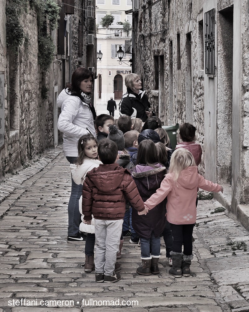 Another blessing of off-season travel is that kids are in school. Now and then you get an adorable treat like this field trip, but it's often quiet. Rovinj, Croatia.