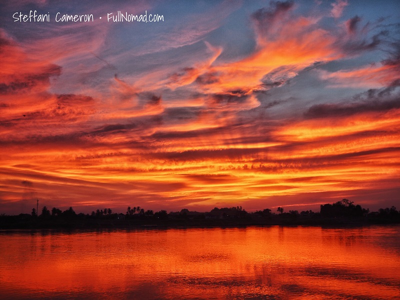 Beautiful fiery sunset over the river