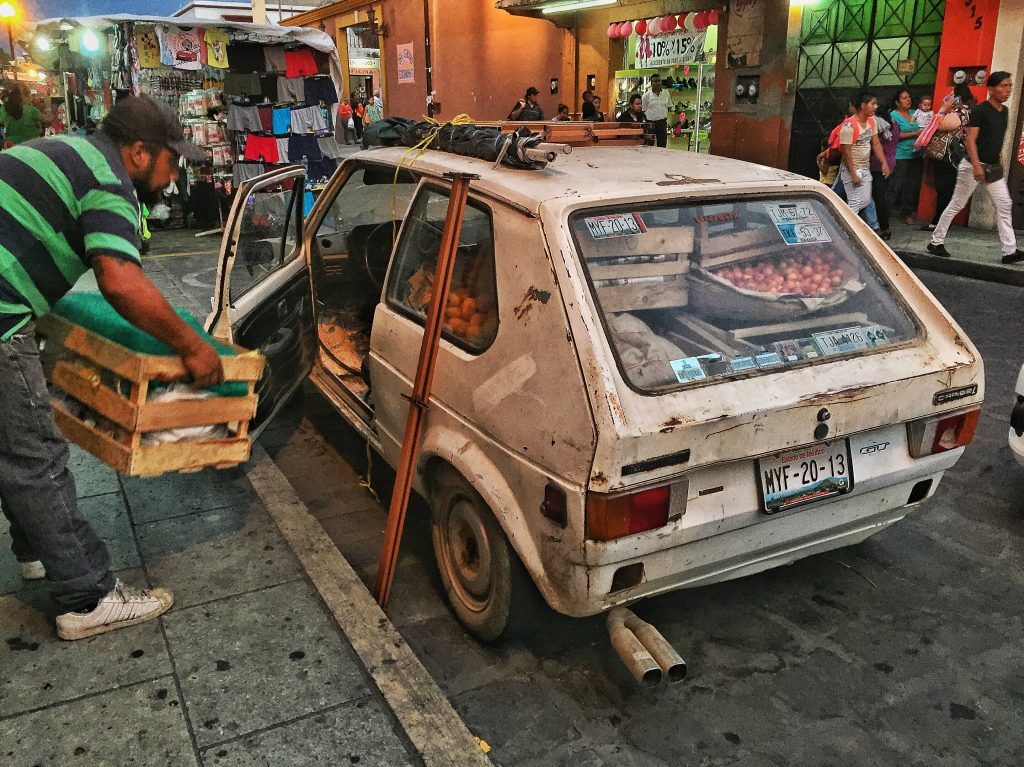 But if I think I've got it hard, it's not even close to the life this guy lives. Here he is packing his car after a day of selling goods on the street.