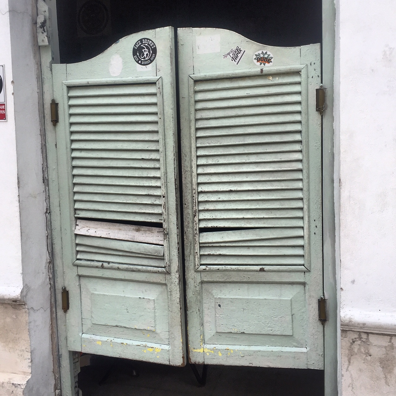 These battered doors have swung open for tequila-swilling masses for nearly 100 years. Merida, Mexico. La Negrita Cantina.
