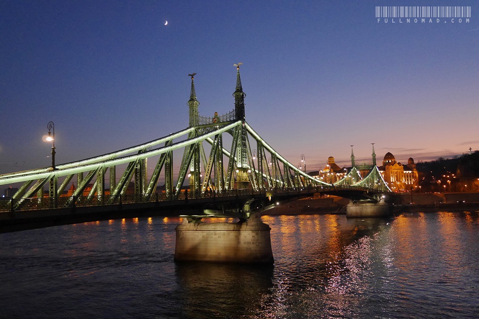 Szabadag Bridge in crosses the Danube River, shown at sunset in December. Its English name is Liberty Bridge.